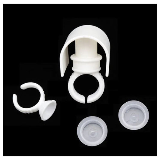 131800   A white plastic eyelash strip eyelash holder and ring with glue cup on top, with 2 aerial views of cup on right hand side on a back background