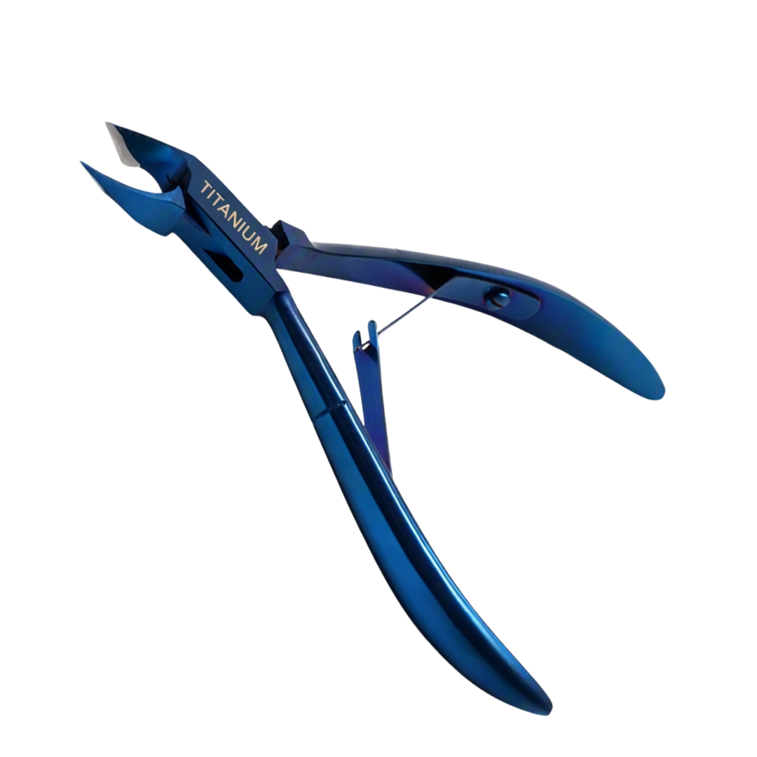 A pair of titanium cuticle clippers in a metallic blue finish, shown on a solid white background. The brand name 'TITANIUM' is printed on the upper jaw of the tool.