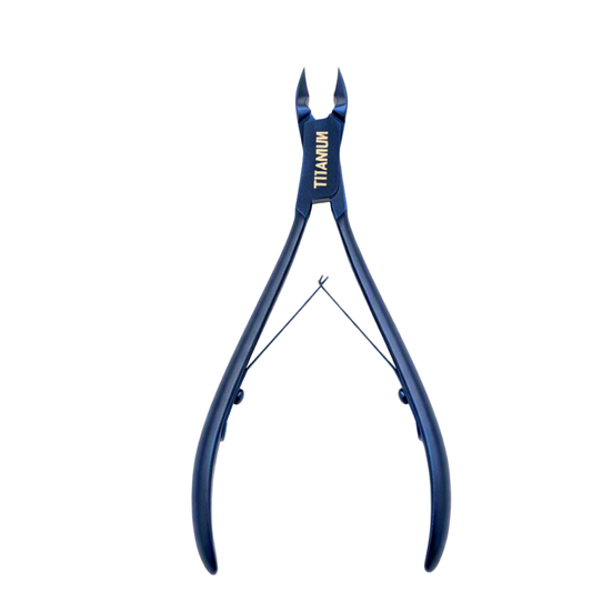 Titanium cuticle cutter nipper with blue handles and gold lettering, shown against a solid white background.