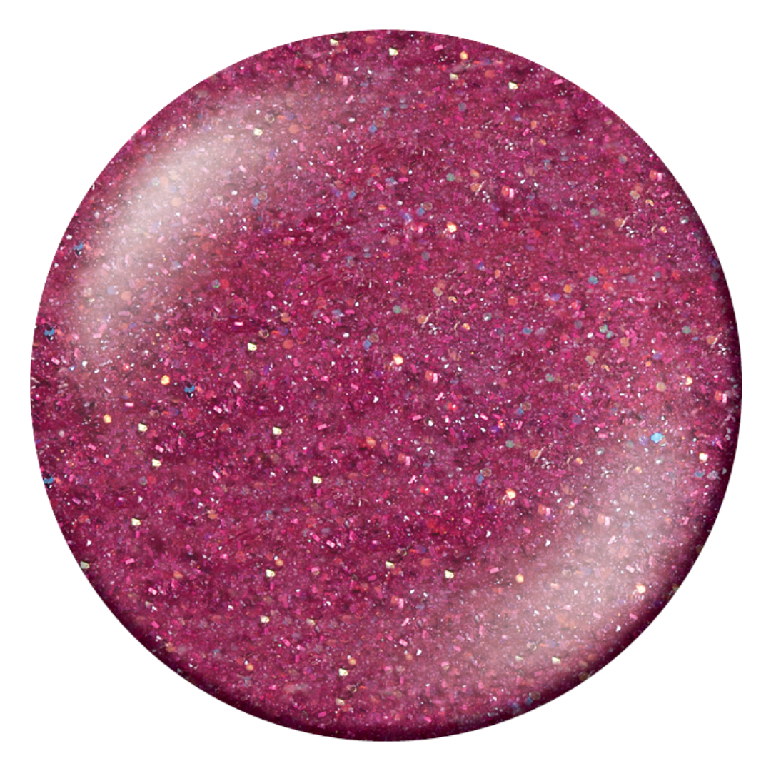 A circular swatch of glittery magenta Supernail Nail Gel with fine shimmer and reflective flecks on a white background.