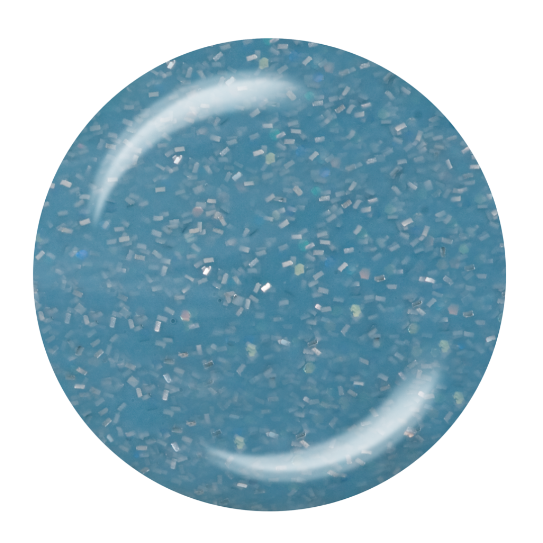 A circular close-up Supernail Nail Gel swatch of a light blue glittery material with fine reflective flakes, shown on a plain white background.