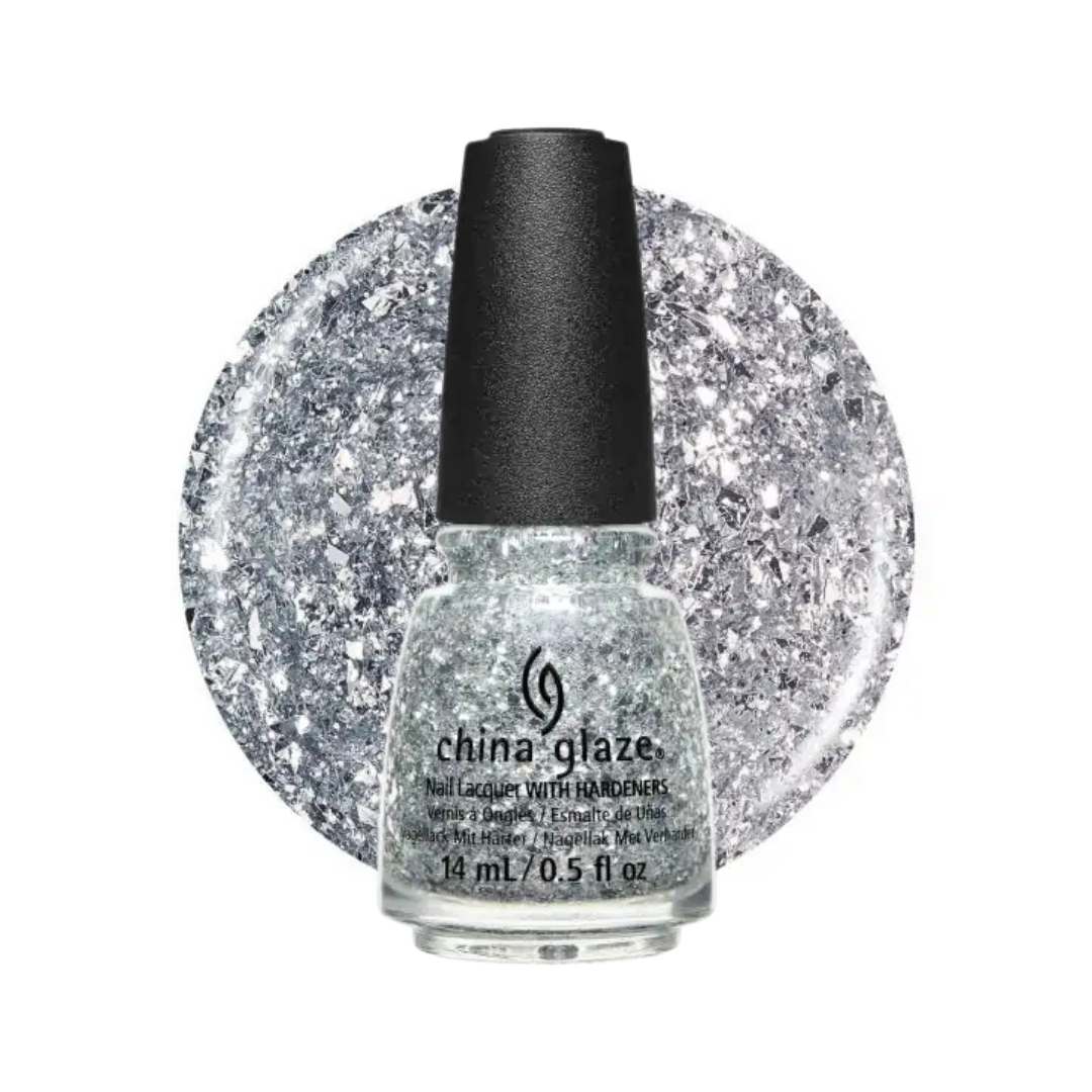 A bottle of China Glaze glitter nail polish with silver and white flakes, featuring a black cap, set against a circular glitter swatch of the same shade on a white background.
