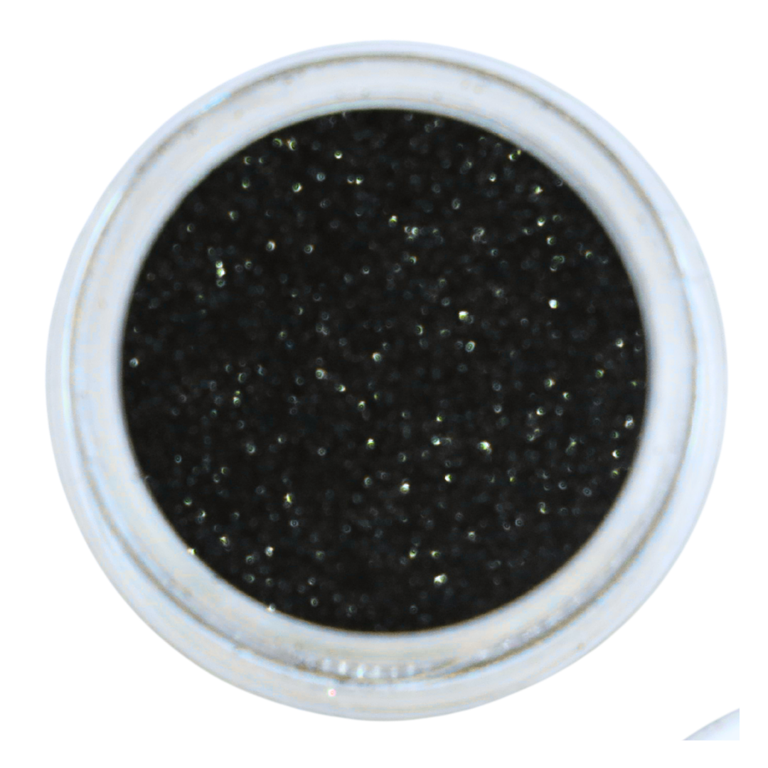 A top-down view of a round white container filled with black nail glitter powder, set against a plain white background.