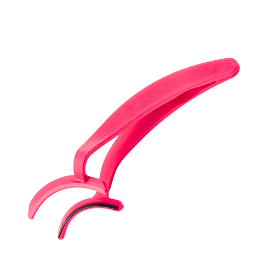 A bright pink plastic eyelash extension application tool with curved arms, shown on a plain white background.