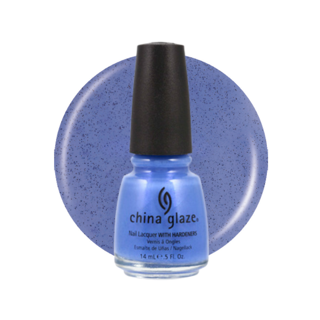 A bottle of China Glaze nail polish in a light periwinkle blue shade with fine silver glitter, shown in front of a matching circular color swatch on a white background.