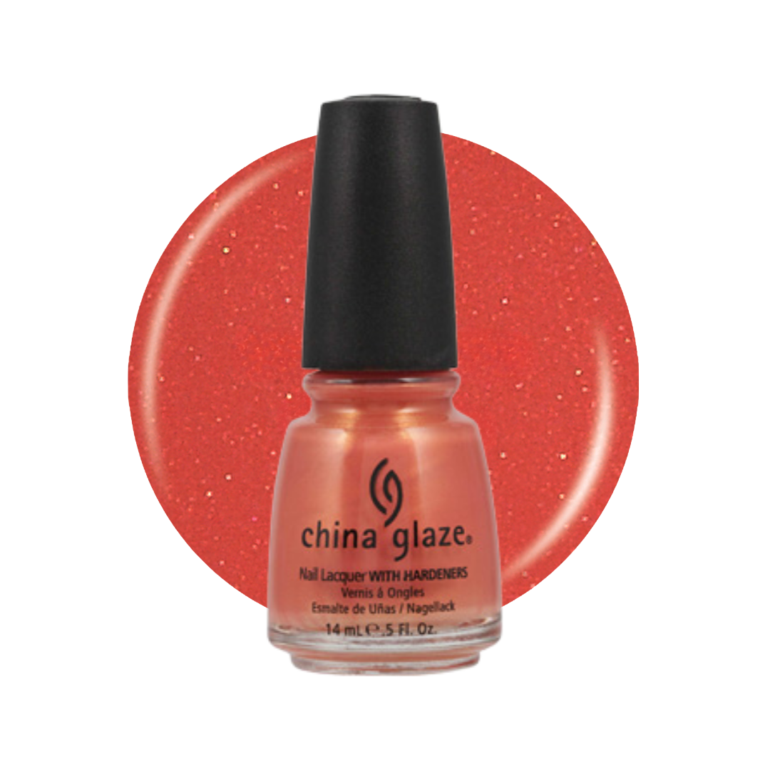 A bottle of China Glaze nail polish with a black cap, shown in front of a large circular swatch of the coral-red glitter polish on a white background.