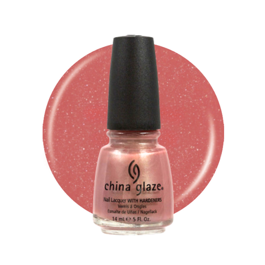 A bottle of China Glaze nail polish with a black cap, shown in front of a circular swatch of the pink glitter polish on a white background.