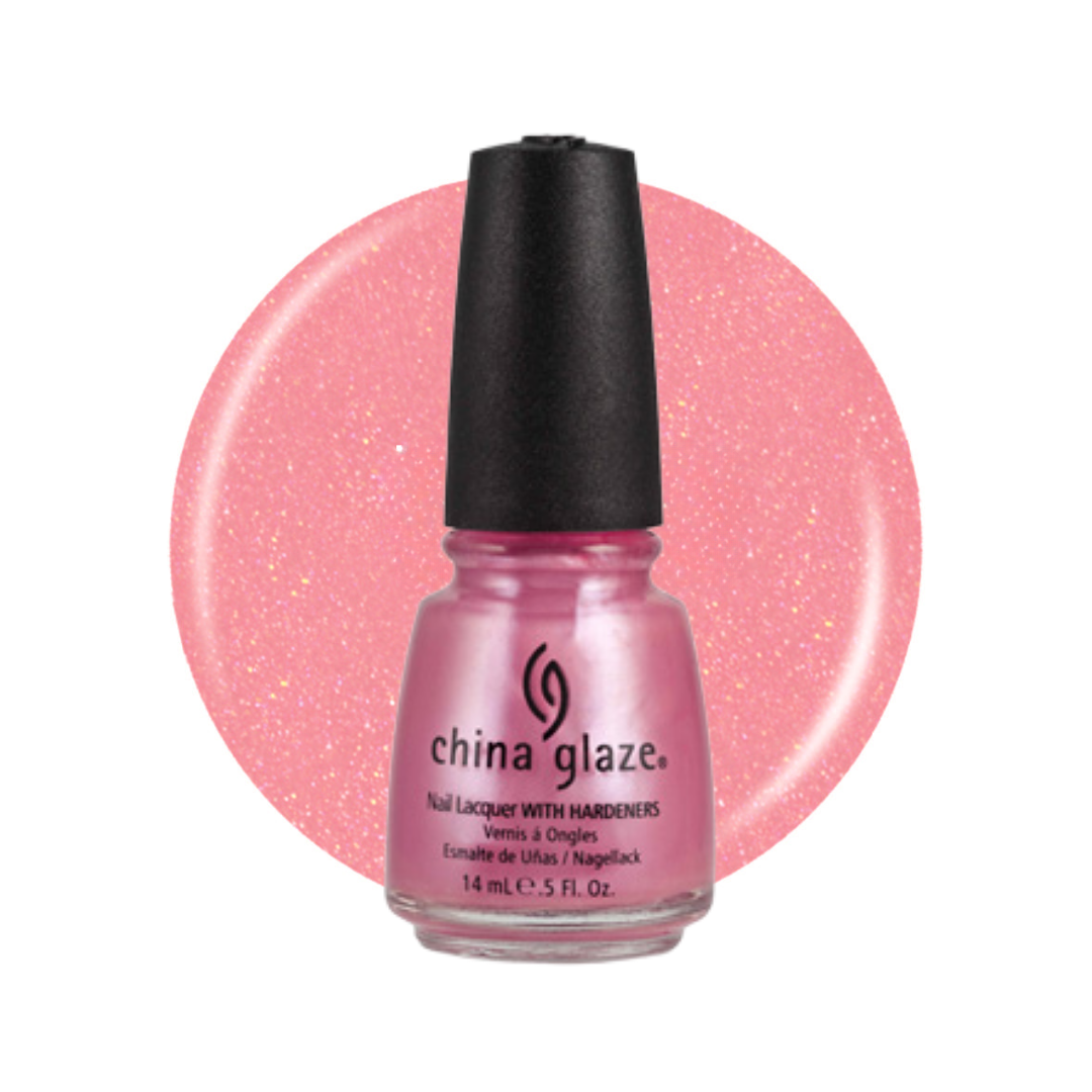 A bottle of China Glaze nail polish in a sparkling light pink shade, shown against a matching pink glitter circle on a white background.