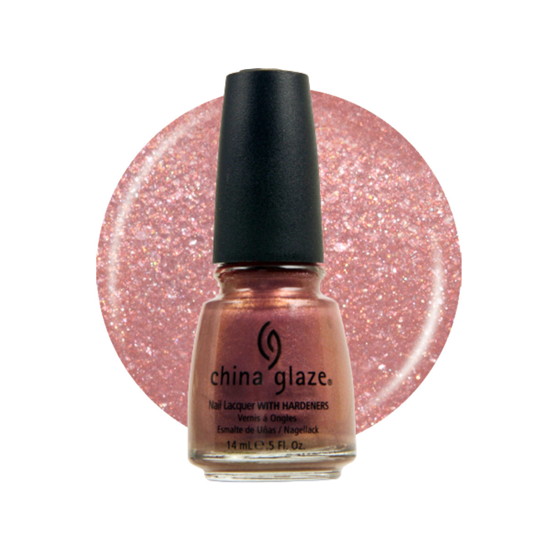 A bottle of China Glaze nail polish with hardeners in a sparkling rose gold shade, shown in front of a circular glitter swatch of the same color on a white background.
