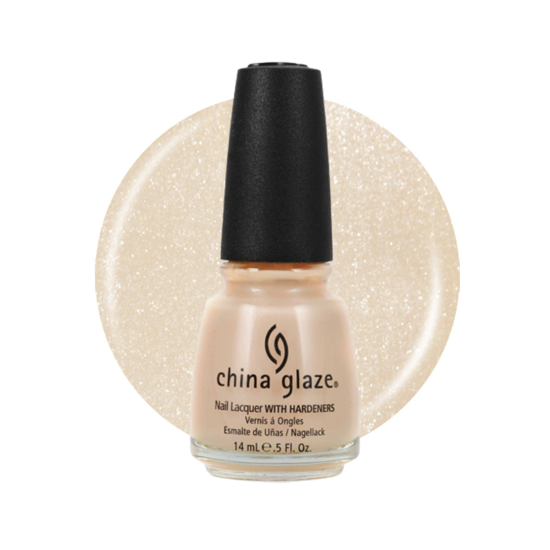 A bottle of China Glaze nail polish in a shimmering champagne beige shade, shown with a circular glitter swatch of the same color behind it on a white background.
