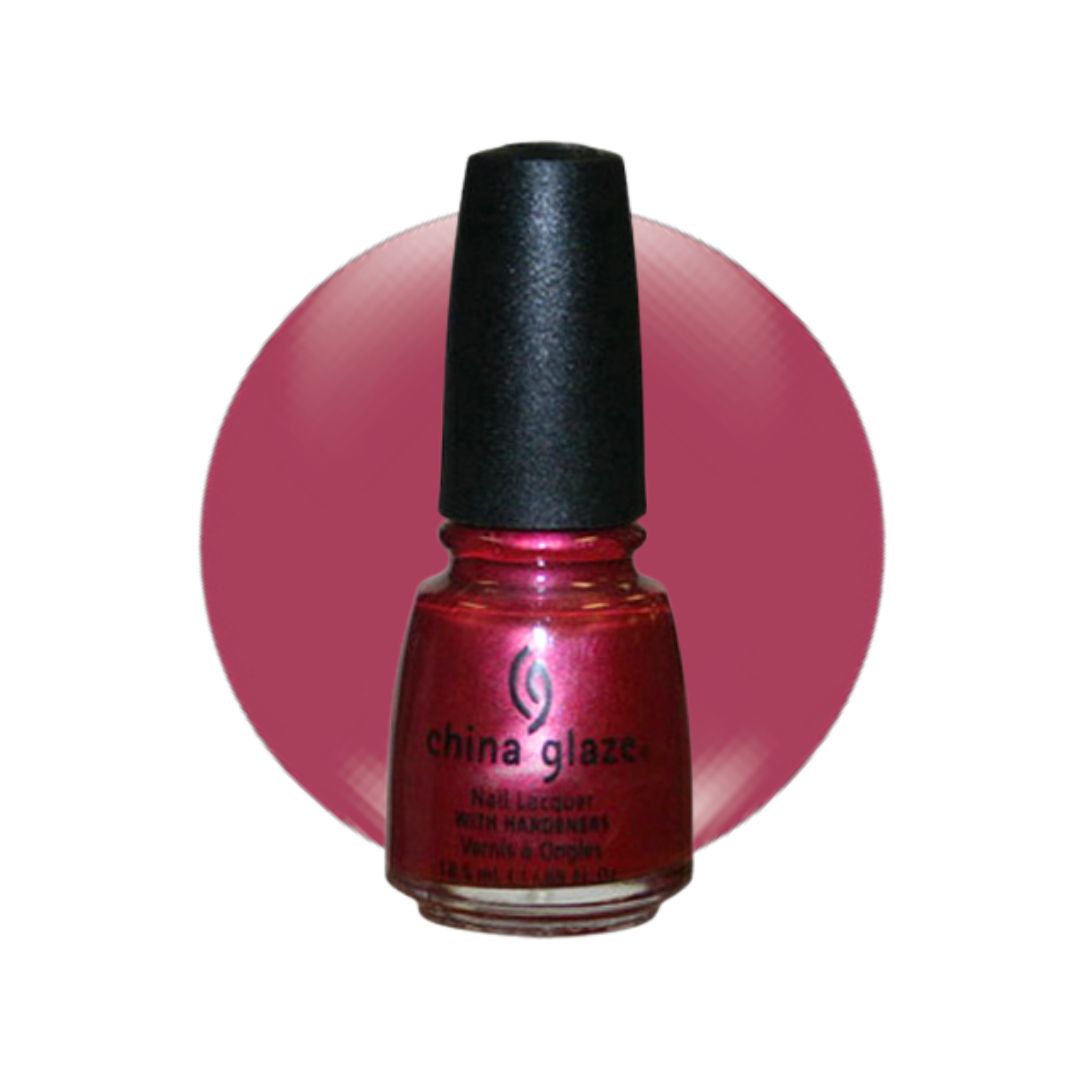 A bottle of China Glaze nail lacquer in a shimmering metallic pink-red shade, set against a solid magenta-pink circular background on a white canvas.