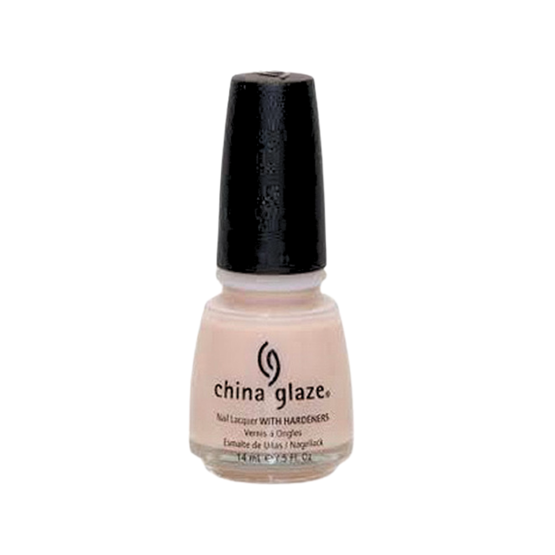 A bottle of China Glaze nail polish in the shade light peach-beige color with a black cap on a white background.