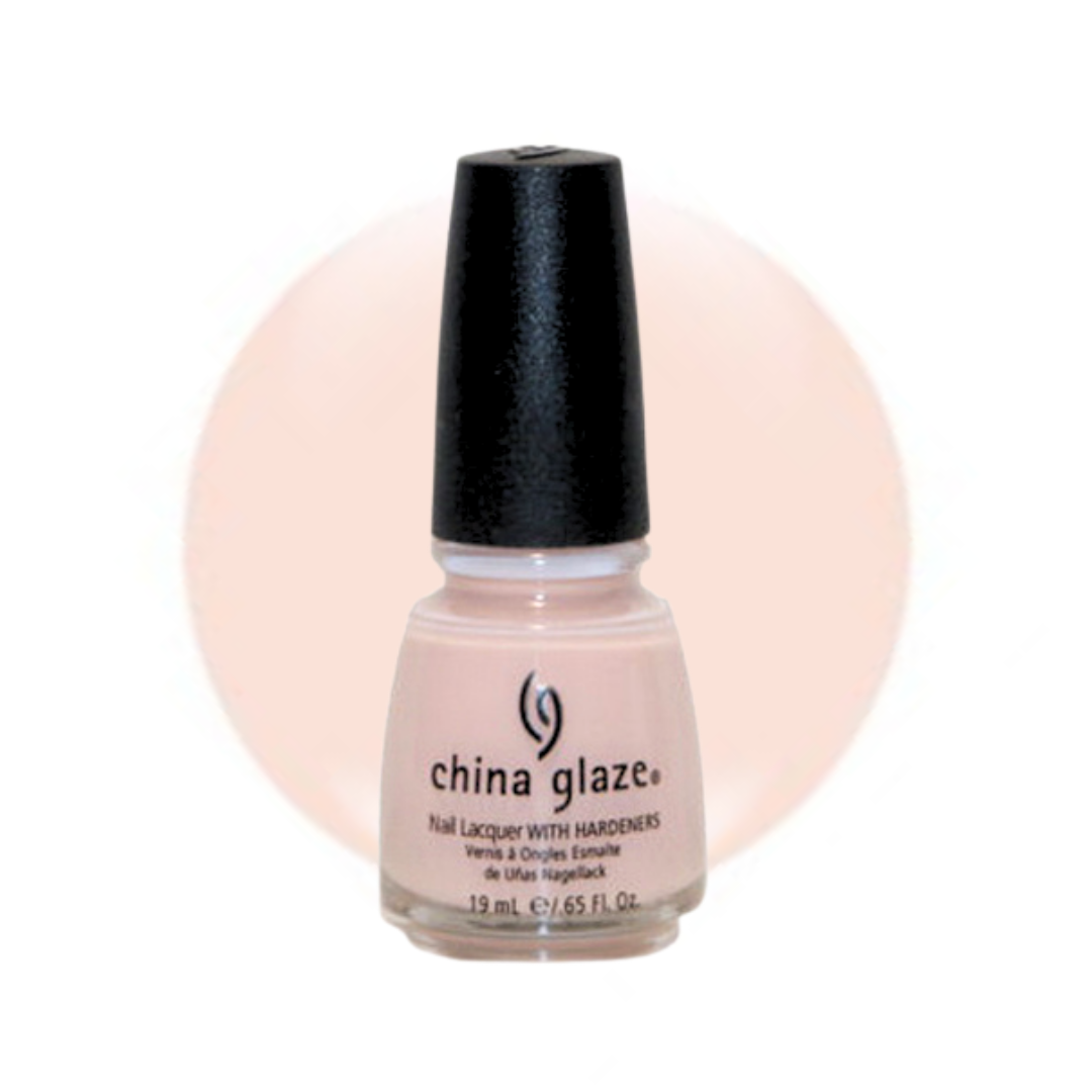 A bottle of China Glaze nail polish with hardeners in a pale peach-pink shade, featuring a black cap and a matching light peach-pink color circle behind it on a white background.