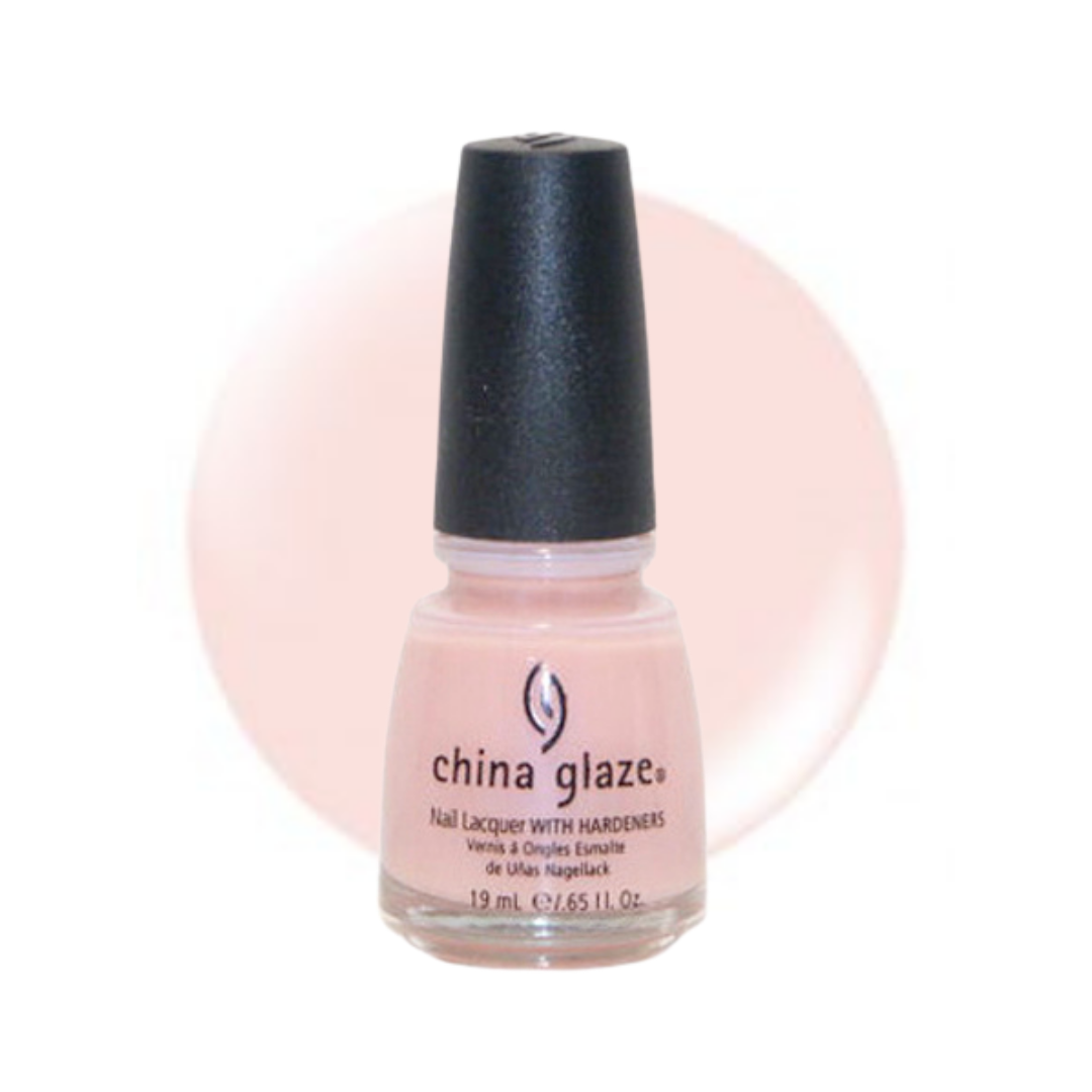 A bottle of China Glaze nail polish in a pale pink shade, featuring a black cap and a light pink color swatch circle in the background.