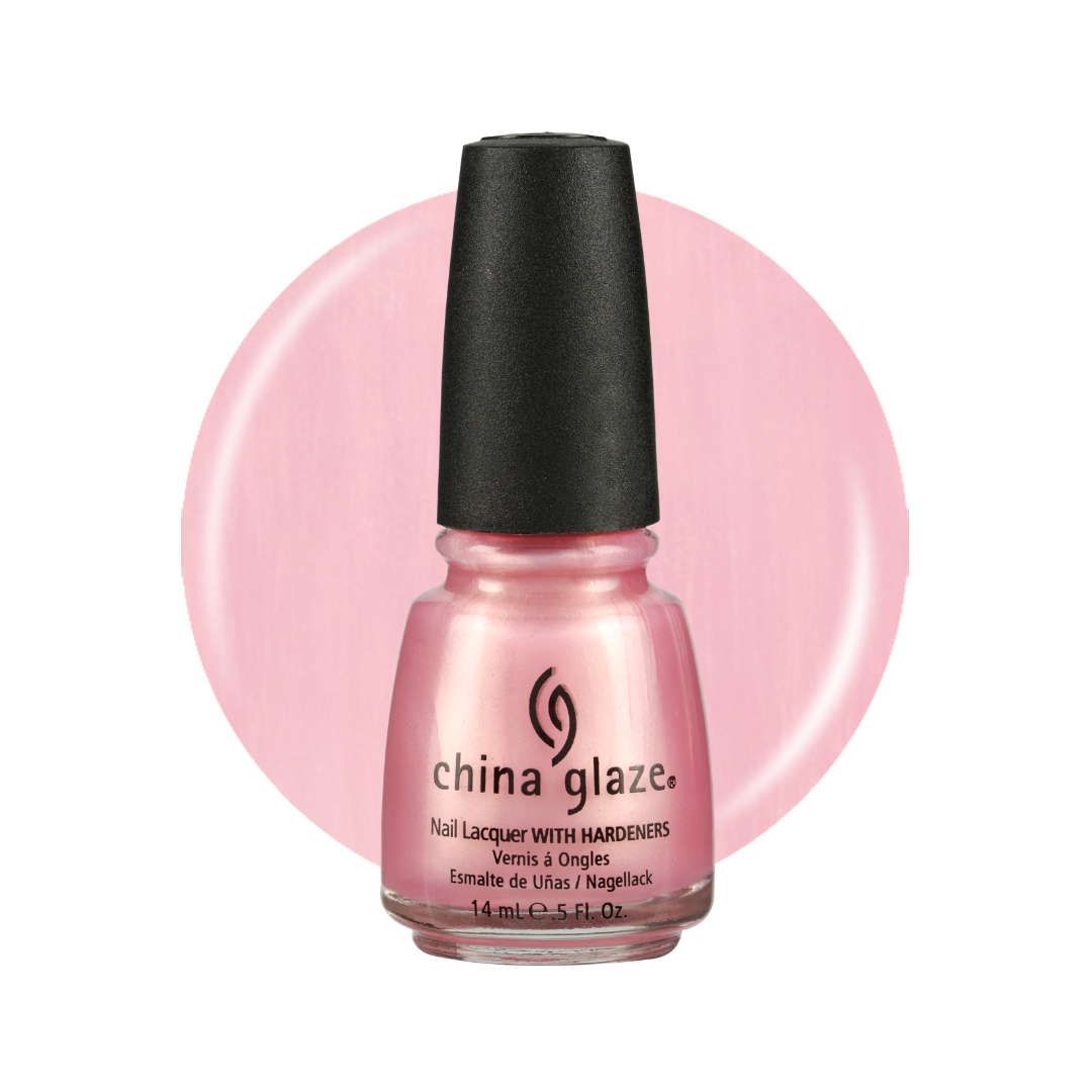 A bottle of China Glaze nail polish in a light pink shade, shown against a white background with a large matching pink circular color swatch behind it.
