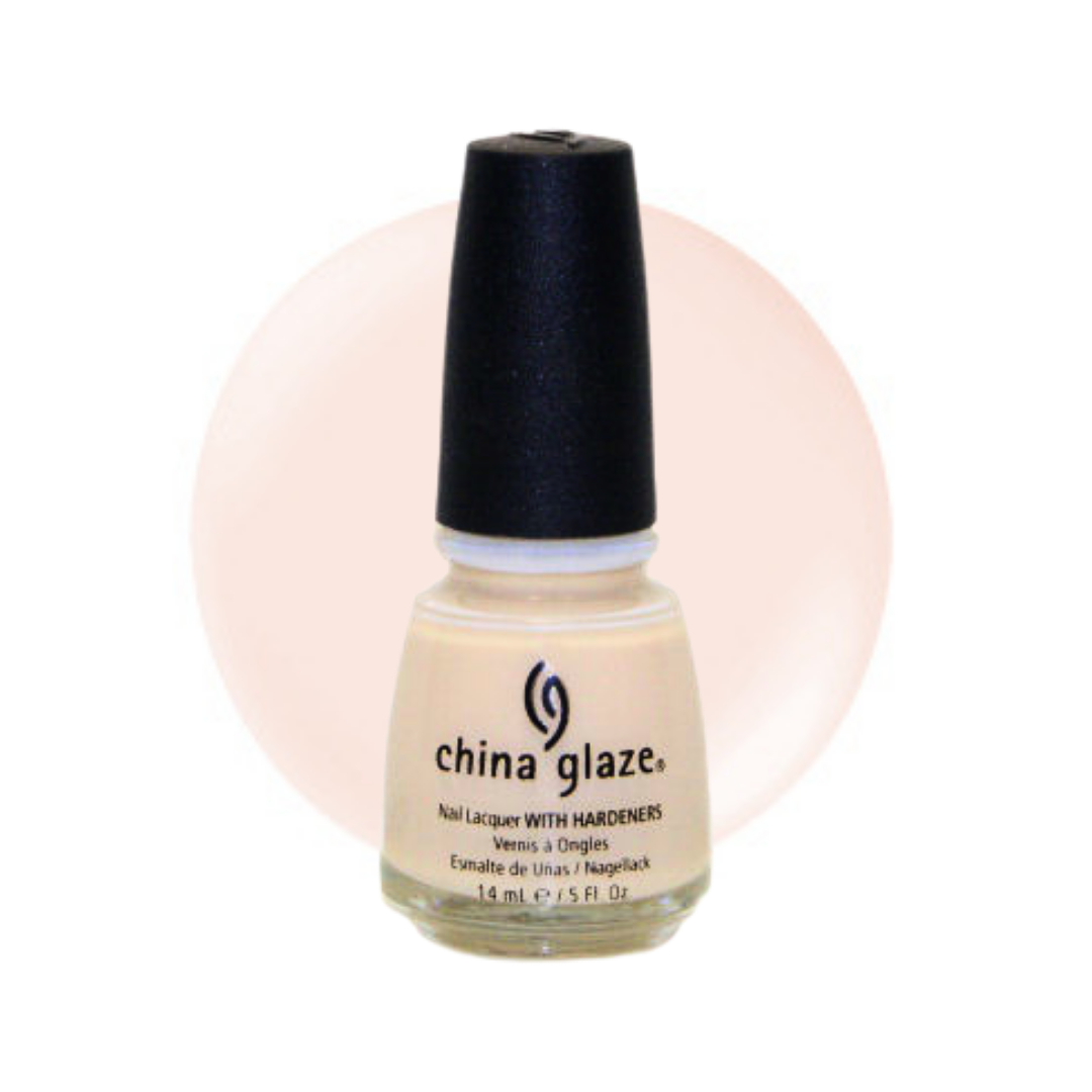 A bottle of China Glaze nail polish with hardeners in a light beige shade, featuring a black cap and a pale pink circular color swatch behind it on a white background.