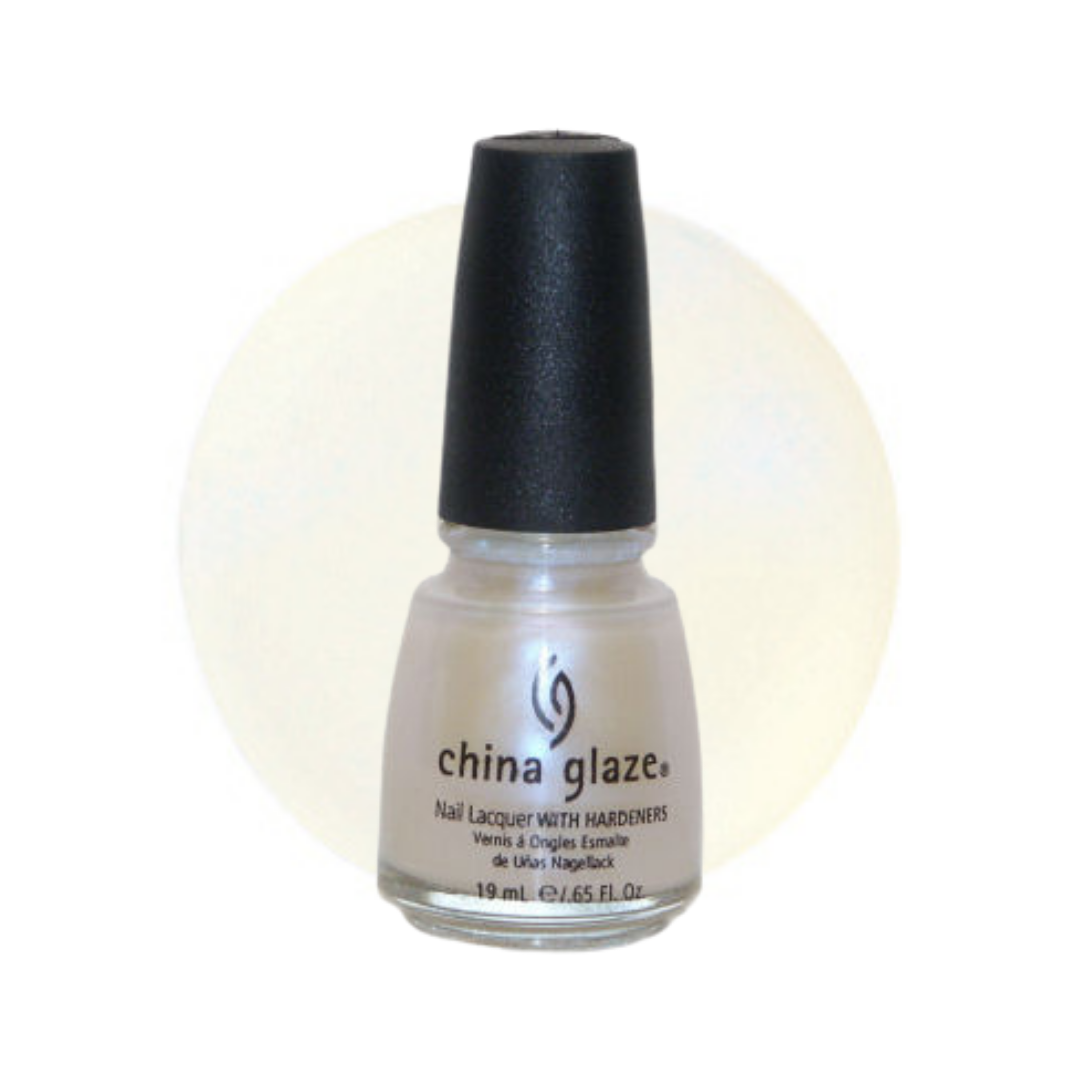A bottle of China Glaze nail polish with a black cap, showing a light pearlescent off-white shade, set against a white background with a soft cream-colored oval color swatch behind it.