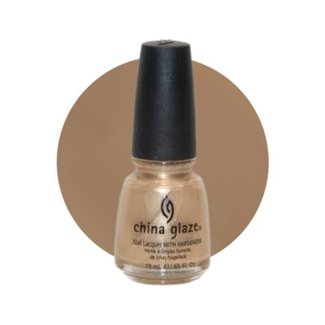 A bottle of China Glaze nail lacquer with hardener in a warm beige gold shade, set against a solid brown circular backdrop on a white background.
