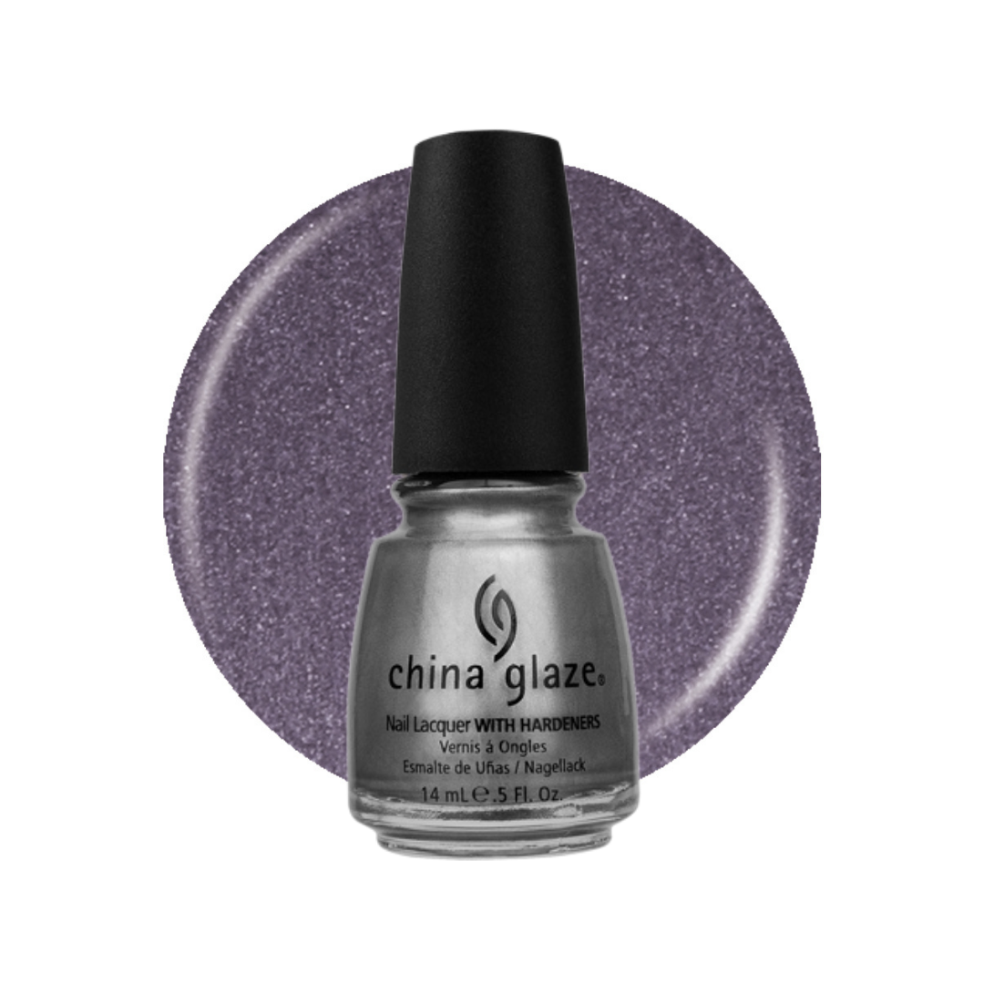 A bottle of China Glaze nail lacquer with a black cap, shown in front of a circular swatch of glittery lavender-silver polish on a white background.