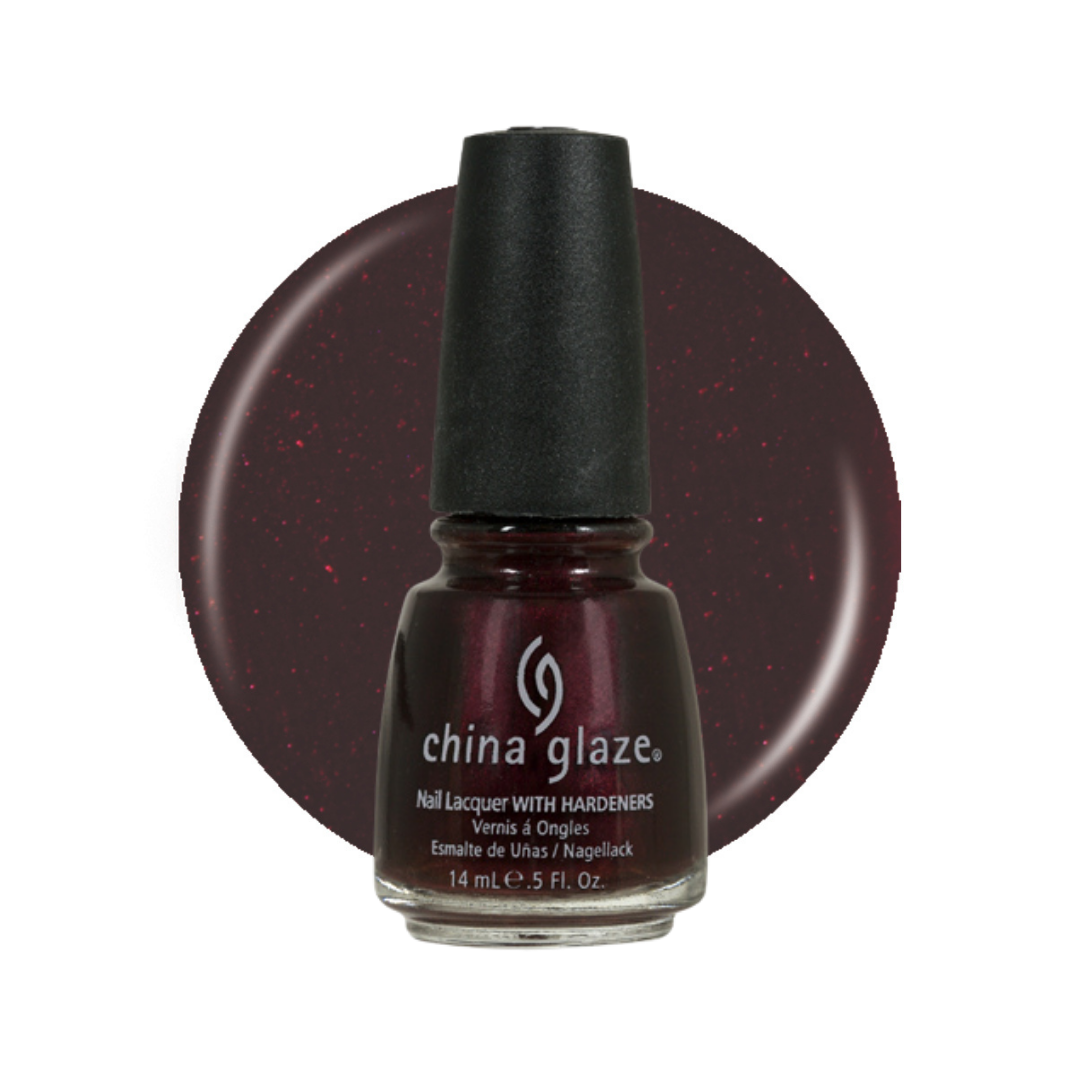 A bottle of China Glaze nail polish with a black cap, shown in front of a circular color swatch of the deep burgundy polish with subtle red glitter. The bottle is labeled 'china glaze' and 'Nail Lacquer WITH HARDENERS'.