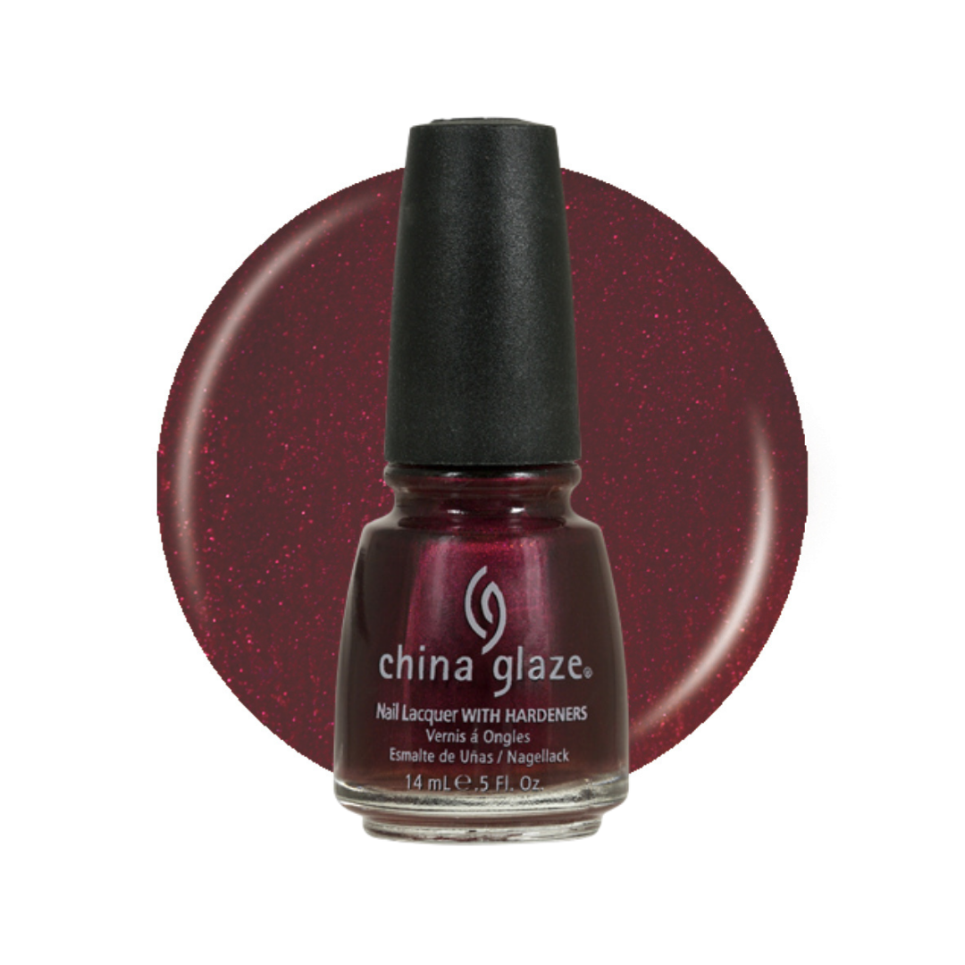 A bottle of China Glaze nail polish in a deep shimmering burgundy-red shade, shown in front of a matching circular color swatch on a white background.