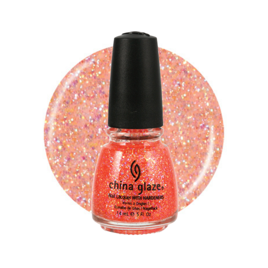 A bottle of China Glaze nail polish with hardener in a bright coral-orange shade with fine pink and purple iridescent glitter, shown in front of a circular glitter swatch of the same shade on a white background.