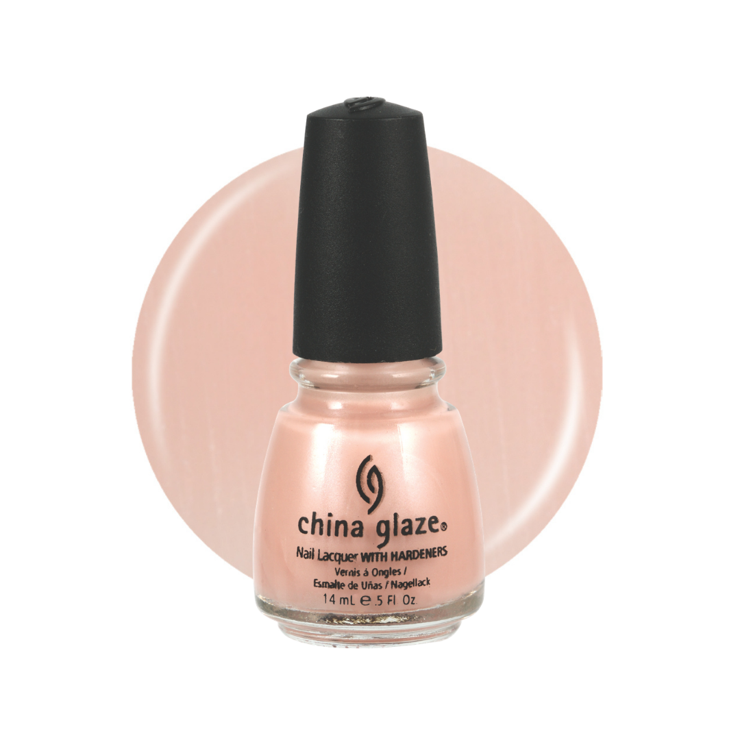 A bottle of China Glaze nail polish featuring a light peach-pink polish and a black cap, set against a matching peach-pink circular color swatch on a white background.