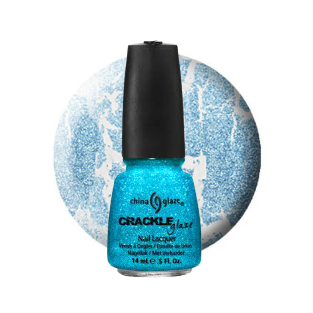 A bottle of China Glaze Crackle Glaze nail lacquer in a bright icy blue glitter shade, shown in front of a matching blue and white glitter circular background on a white studio background.