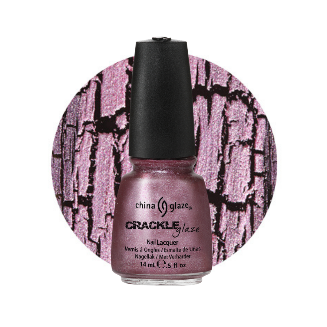 A bottle of China Glaze Crackle Glaze nail polish in a shimmering dusty mauve-pink shade, shown in front of a circular swatch displaying the crackle texture of the polish.