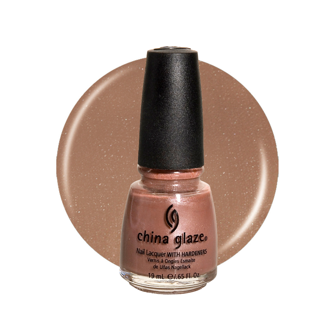 A bottle of China Glaze nail polish in a warm, shimmery peachy-beige shade, displayed in front of a large circular color swatch of the same polish on a white background.