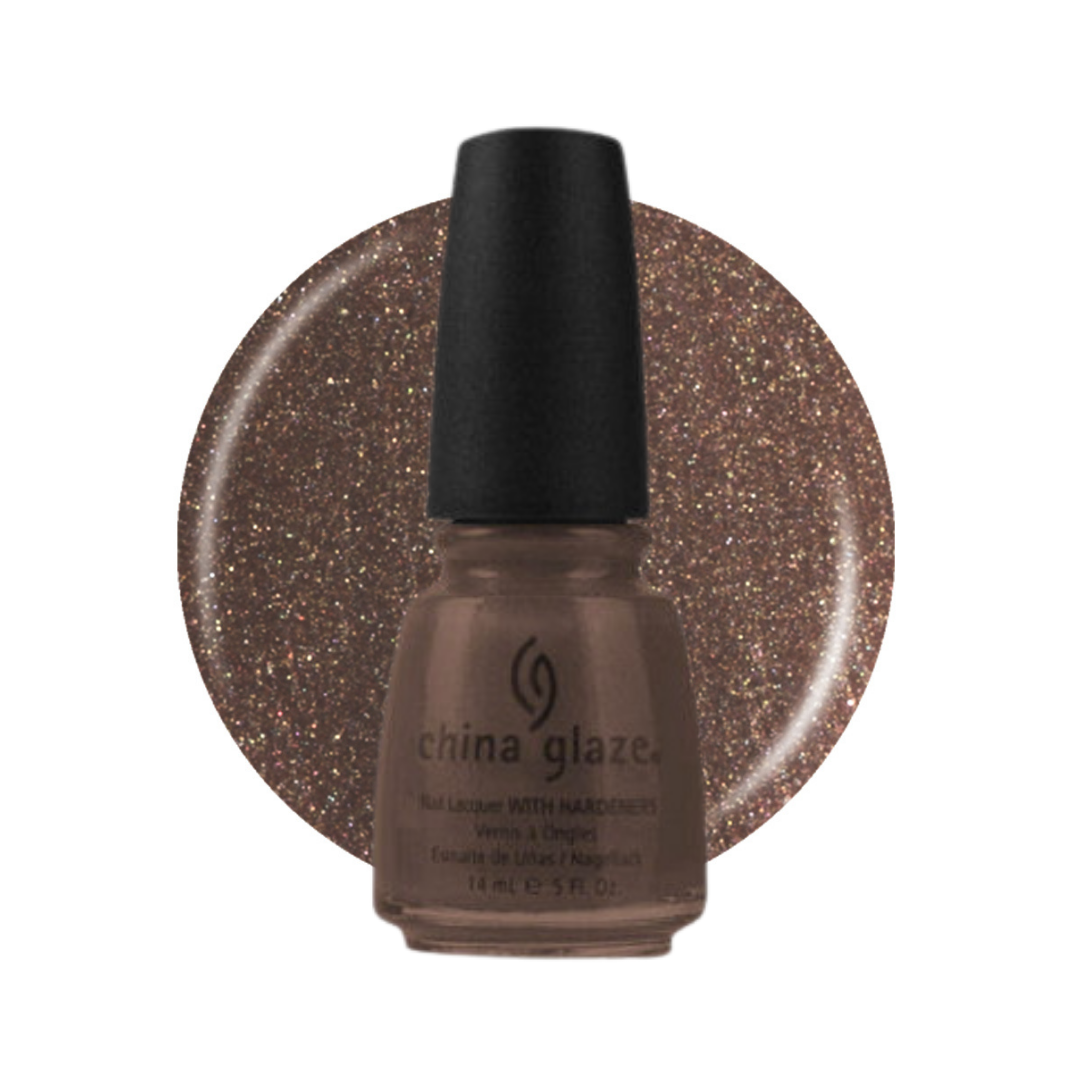 A bottle of China Glaze nail polish with a black cap, shown in front of a circular glitter swatch of the same warm bronze-brown shade on a white background.