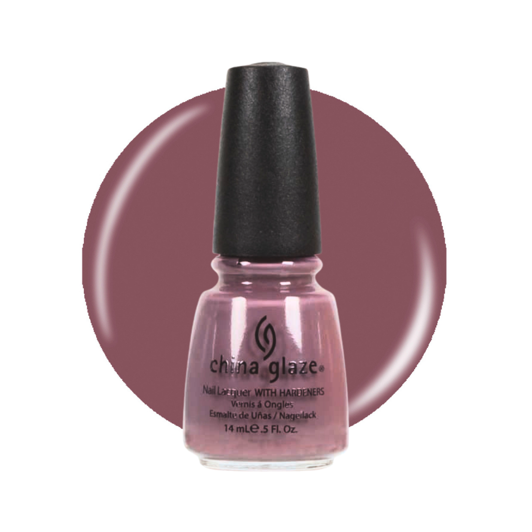 A bottle of China Glaze nail polish with hair builders in a dusty mauve-pink shade, shown in front of a matching circular color swatch on a white background.