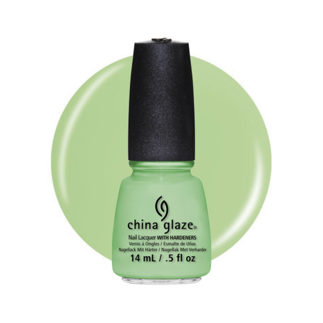A bottle of China Glaze nail polish in a light mint green shade, shown against a matching light green circular background on a white studio backdrop.