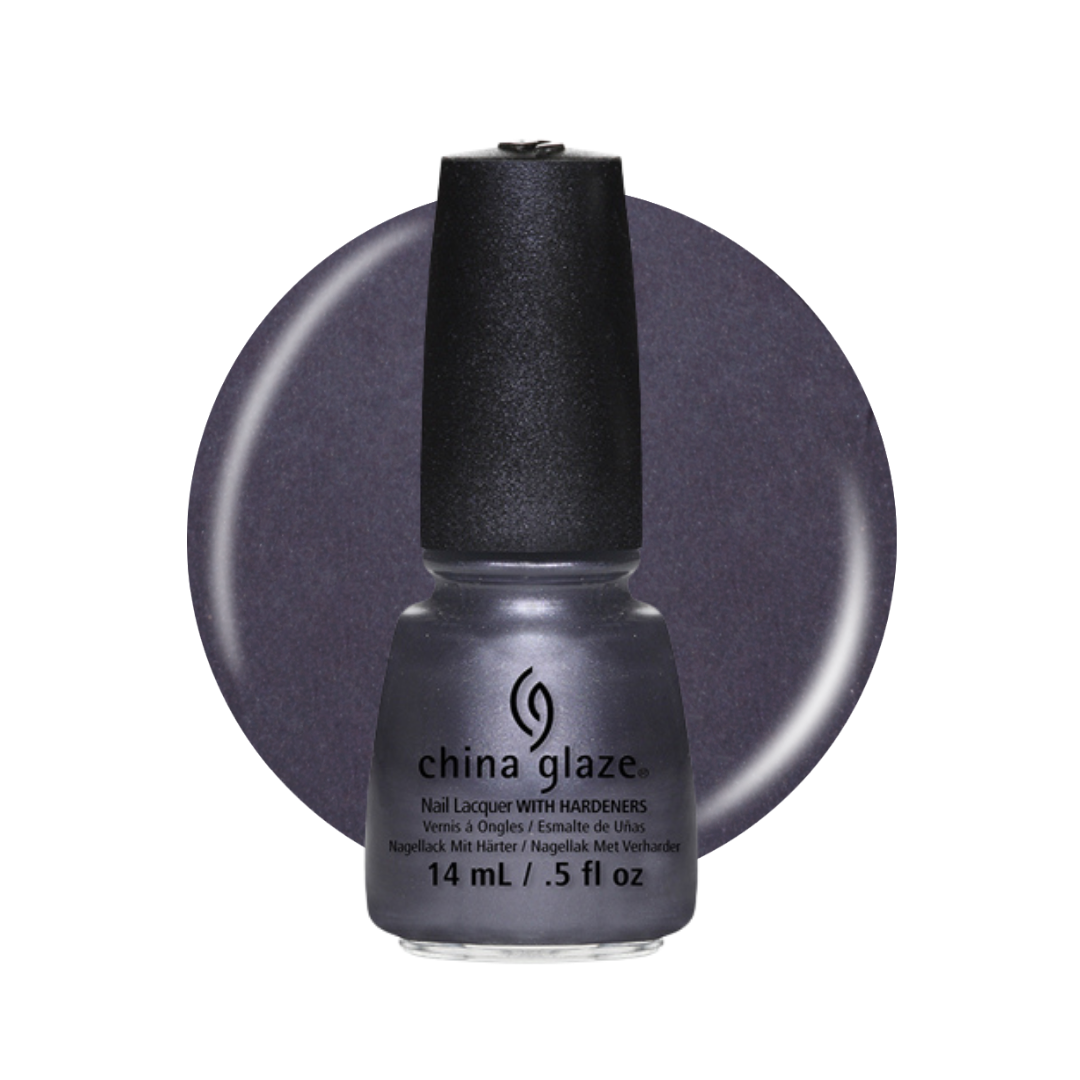 A bottle of China Glaze nail lacquer with a black cap, shown in front of a circular color swatch of the polish, which is a dark plum purple.