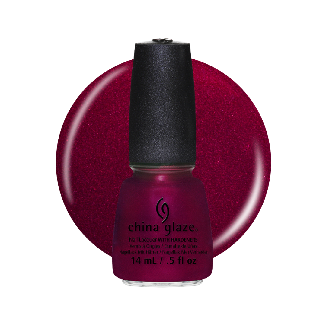 A bottle of China Glaze nail polish with a black cap, shown in front of a large circular swatch of the deep berry-red polish color on a white background.