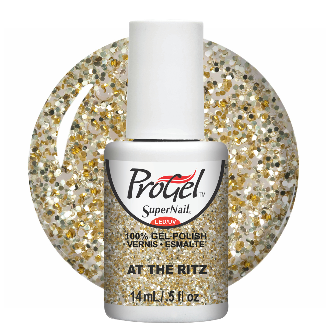 A bottle of ProGel SuperNail LED UV gel polish in the shade 'At The Ritz', featuring a white cap and a clear bottle showing the glittery gold and white polish inside. A circular graphic behind the bottle displays the full glitter pattern of the polish.