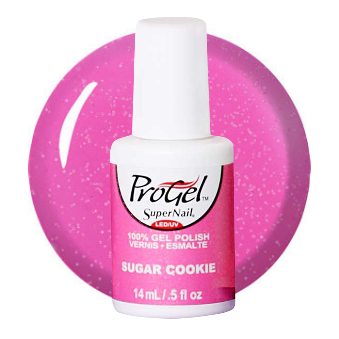 A bottle of Progel SuperNail LED UV gel nail polish in the shade 'Sugar Cookie', featuring a white cap and a pink label, set against a large circular swatch of the pink glitter polish.