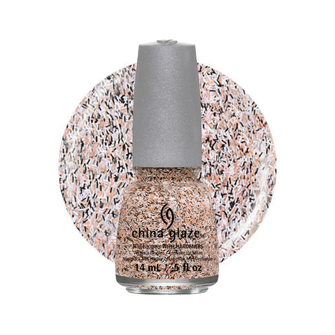 A bottle of China Glaze nail polish with a silver cap, filled with a glittery peach, pink, and black speckled polish, set against a matching circular swatch on a white background.