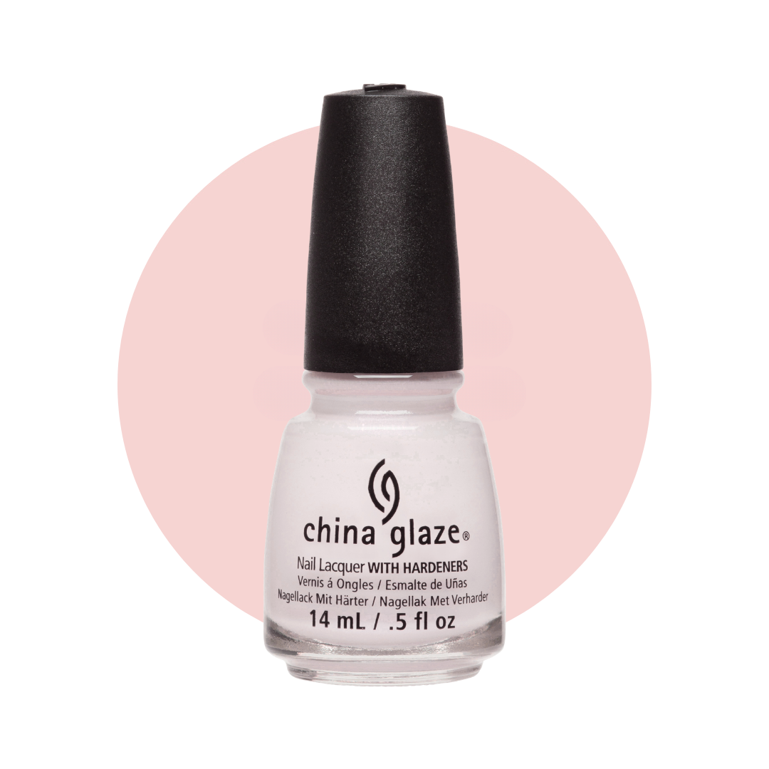 A bottle of China Glaze nail lacquer with hardeners in a sheer white shade, featuring a black cap and a black printed logo, set against a light pink circular graphic on a white background.