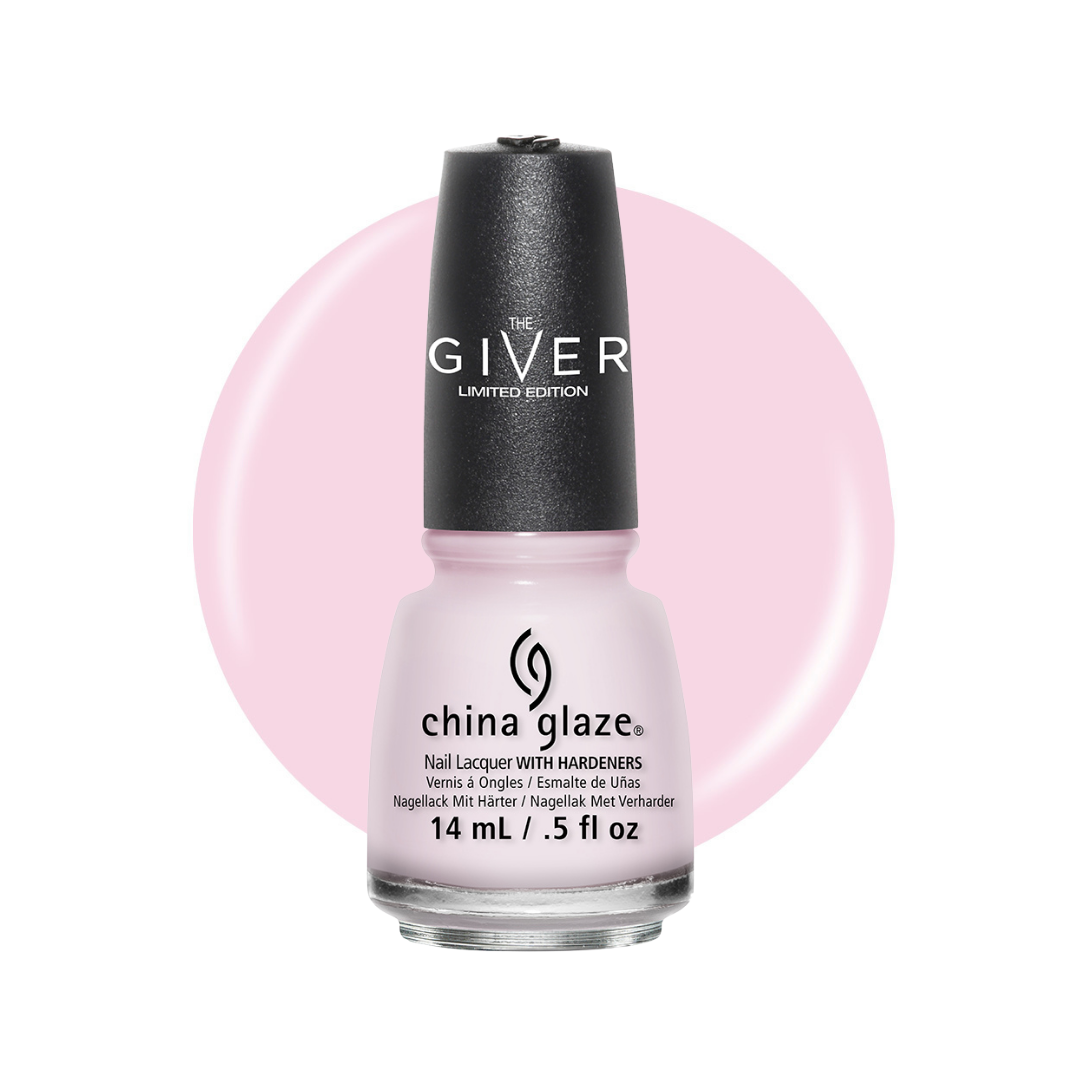 A bottle of China Glaze The Giver Limited Edition nail lacquer with hardeners. The nail polish inside is a very pale pink, visible through the clear glass bottle.
