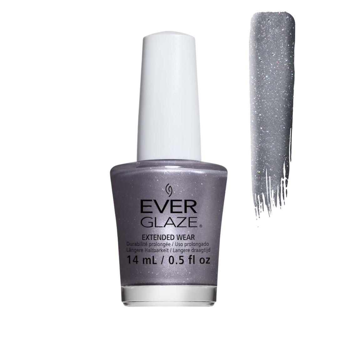 A bottle of Ever Glaze Extended Wear nail polish in a shimmering lavender-gray shade, shown next to a vertical swatch of the glittery gray polish on a white background.