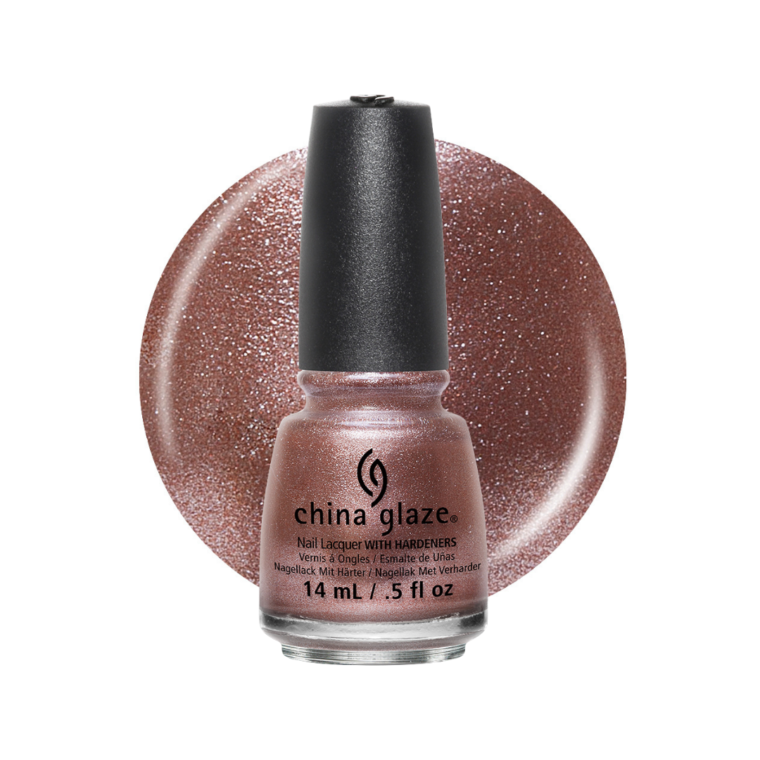 A bottle of China Glaze nail polish in a sparkling rose gold shade, shown in front of a matching circular glitter swatch on a white background.