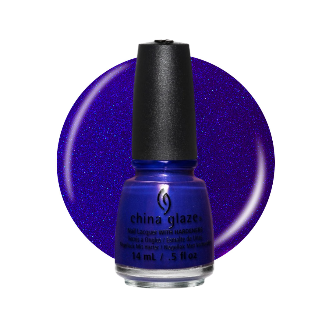 A bottle of China Glaze nail polish in a deep blue shade with a black cap, set against a large circular swatch of the same glittery blue polish on a white background.
