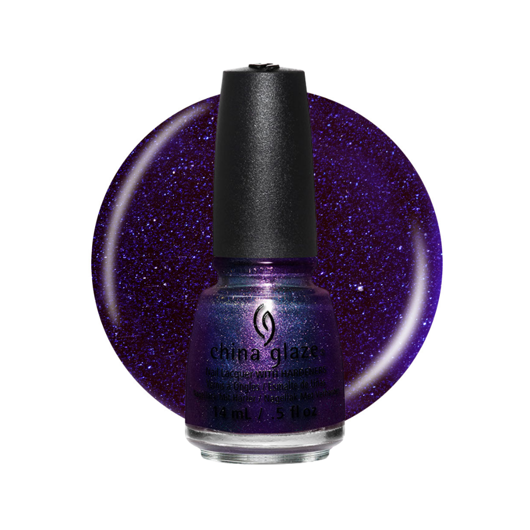 A bottle of China Glaze nail polish in a deep purple shade with fine silver glitter, shown in front of a large circular color swatch of the same glittery purple polish on a white background.
