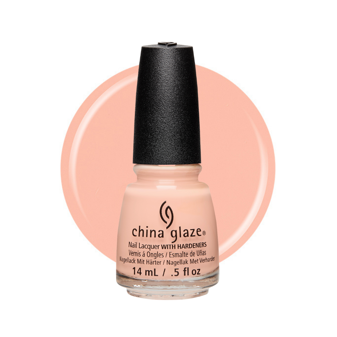 A bottle of China Glaze nail polish with a black cap, shown against a peach-colored circular background on a white studio background.