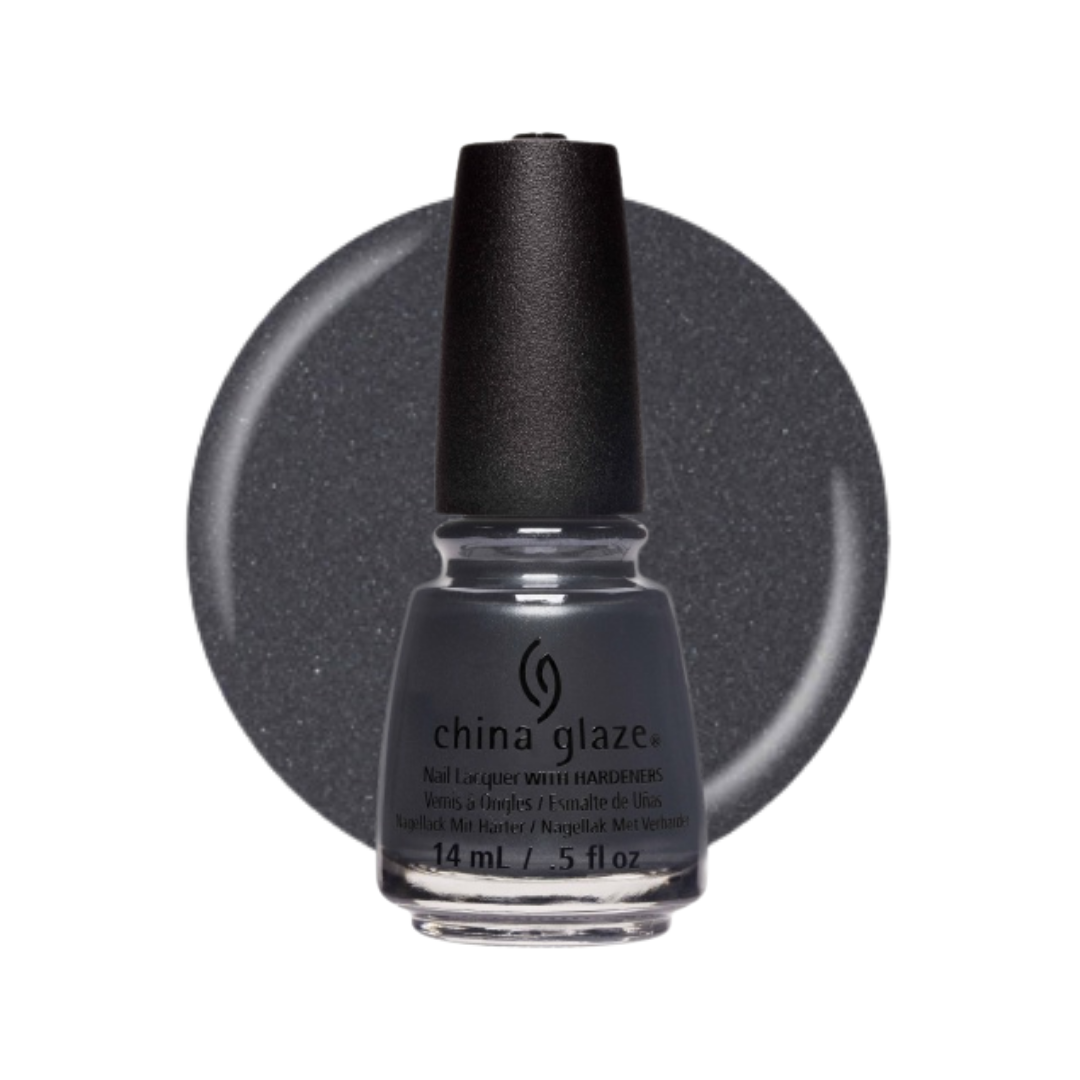 A bottle of China Glaze nail lacquer with a black cap, shown in front of a circular swatch of the dark gray glitter polish on a white background.