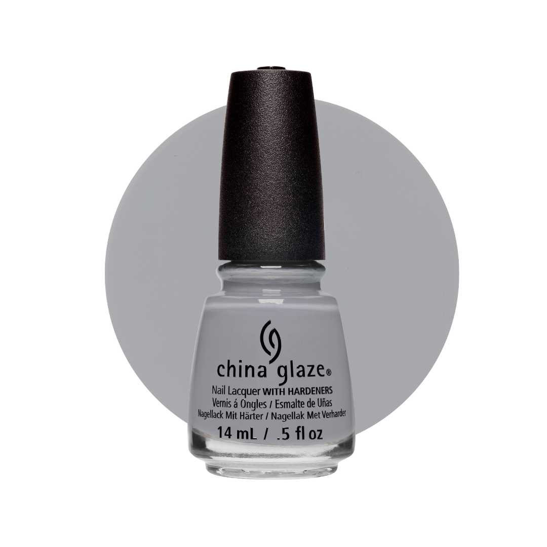 A bottle of China Glaze nail lacquer with hardeners in a light gray shade, featuring a black cap and a gray circular color swatch behind it on a white background.