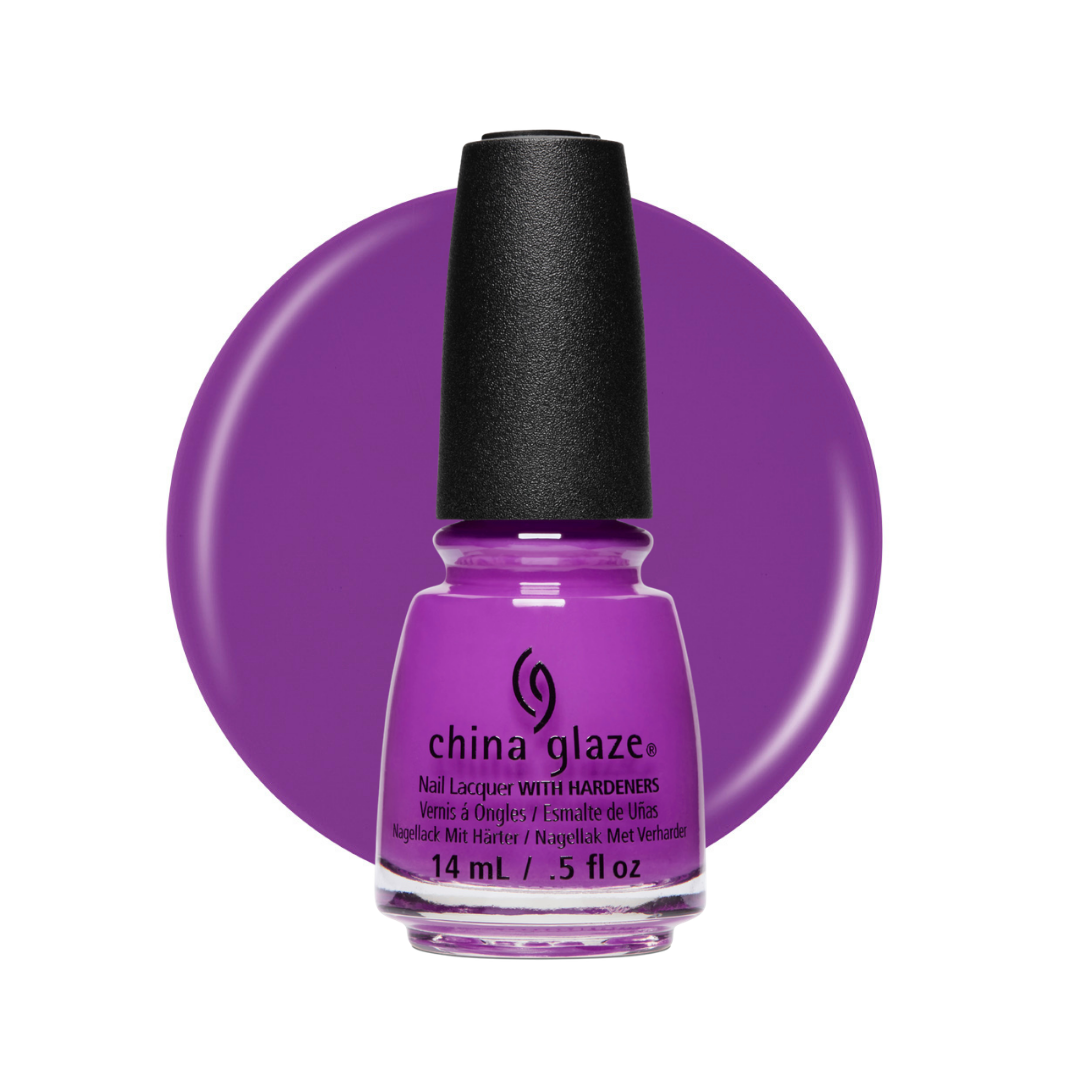 A bottle of China Glaze nail lacquer in a vibrant purple shade, shown against a matching purple circular background on a white studio backdrop.