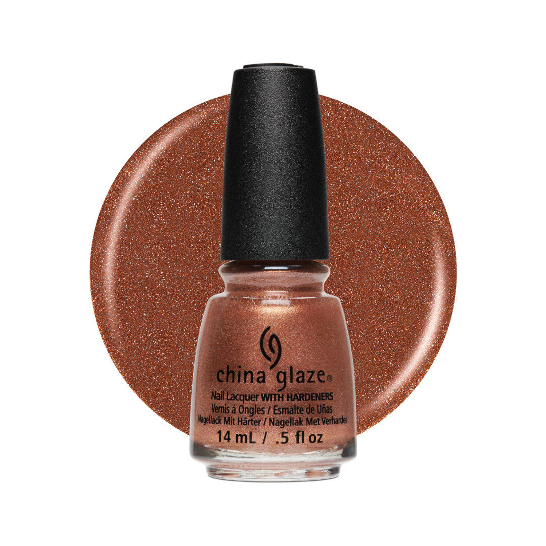 A bottle of China Glaze nail polish with a black cap, shown in front of a large circular swatch of the glittery copper-rose polish color on a white background.