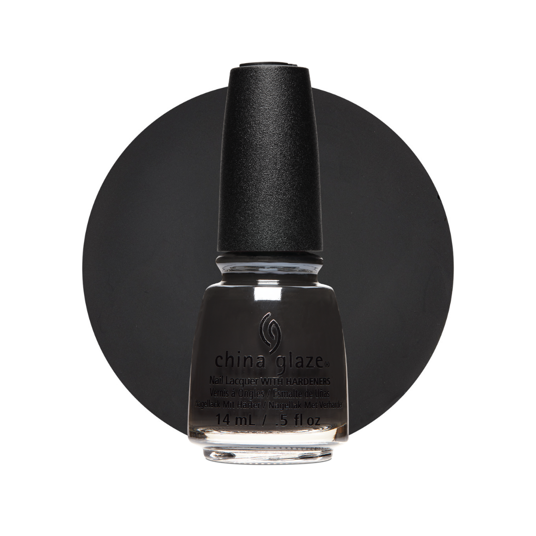 A bottle of China Glaze nail lacquer in a dark charcoal gray shade, set against a solid black circular background on a white canvas.